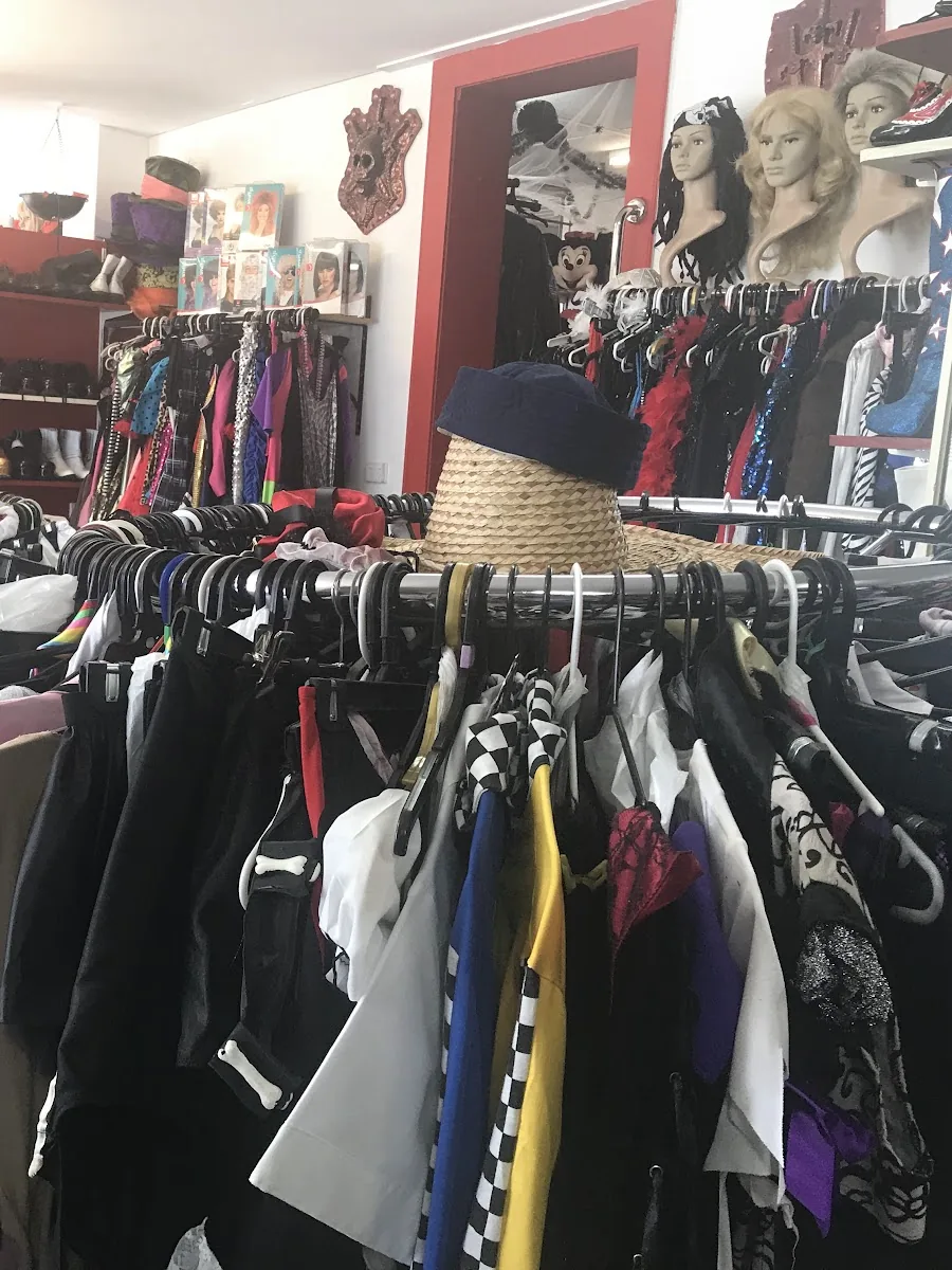 Round racks packed with costumes, wig heads and hats inside the Janina's showroom at Bracken Ridge